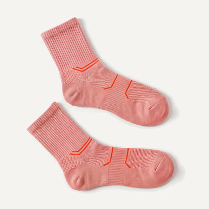 Crew Compression Socks in Coral Pink, pair laid flat