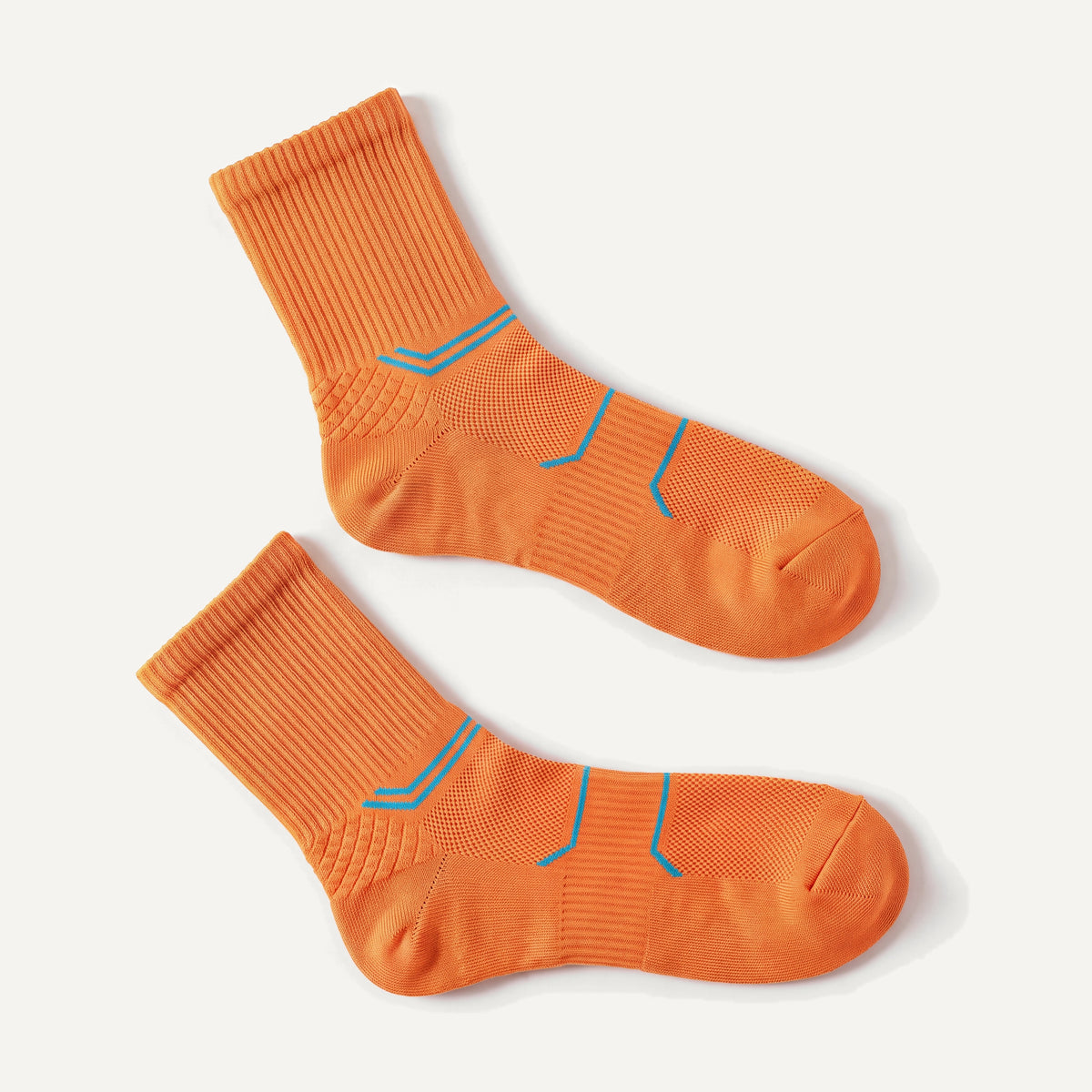 Crew Compression Socks in Orange, pair laid flat
