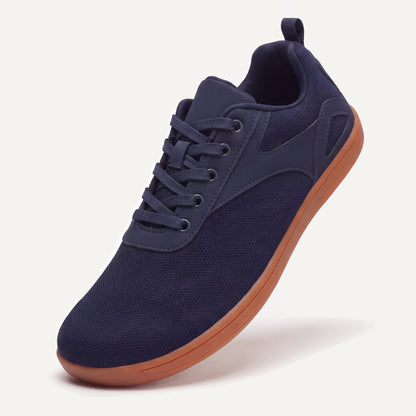 Ogni Vie in Navy, standing on the toe, top view of the laces