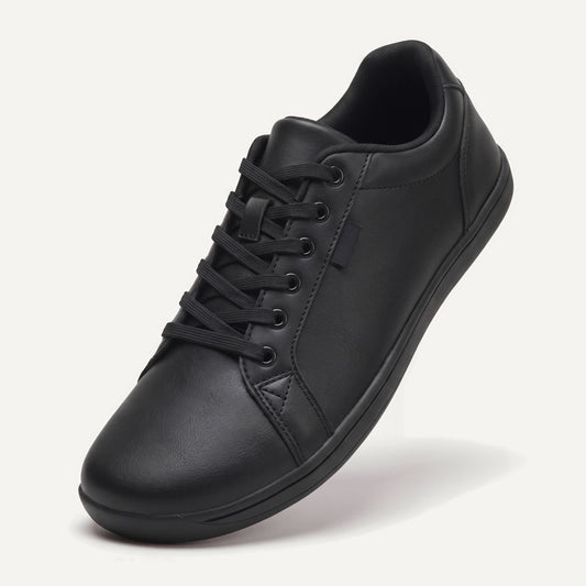 Pelle Vie in Black, standing on the toe, top view of the laces