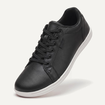 Pelle Vie in Classic (black upper, white sole), standing on the toe, top view of the laces